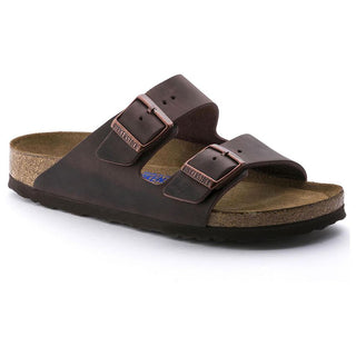A pair of Birkenstock Arizona sandals in brown color with an oiled nubuck leather upper, two adjustable straps with metal pin buckles, and a soft footbed.