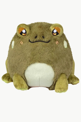 A plush frog toy. The frog is olive green with a cream-colored belly and embroidered orange eyes.
