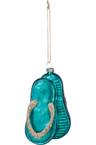 A turquoise flip-flop-shaped hanging ornament with glittery gold straps and a natural jute hanging string, shown against a plain white background.