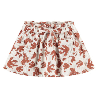 A white and burnt orange  coral patterned girls skirt