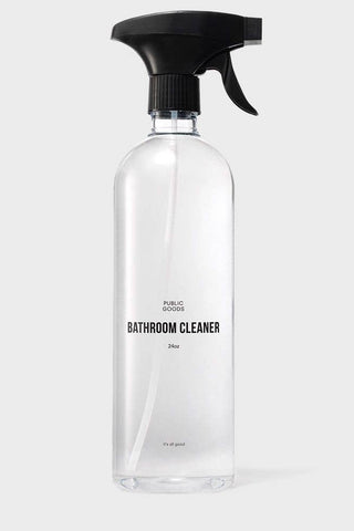 A clear plastic spray bottle labeled 'BATHROOM CLEANER' with a black spray nozzle.